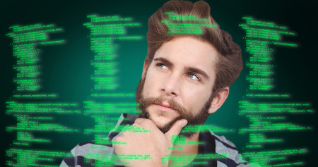 Close-up of thoughtful hipster with hand on chin against green background with vignette
