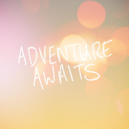 Adventure awaits word against greyの写真素材
