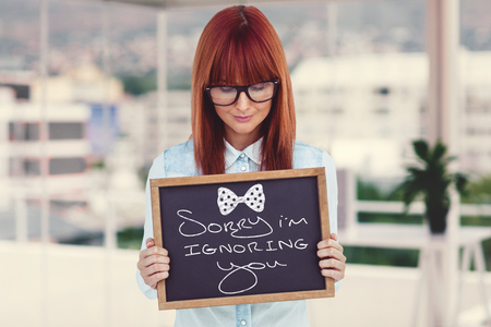 Woman holding small blackboard in her hands