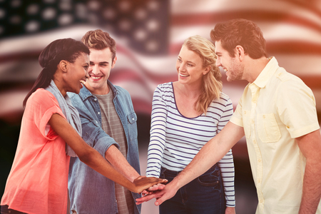Happy creative team giving a motivational gesture against composite image of digitally generated united states national flagの写真素材