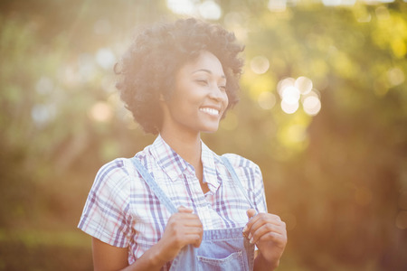 Smiling woman in the garden looking awayの写真素材