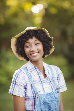 Smiling woman in the garden looking at the cameraの写真素材