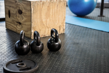 kettlebells and wooden block at the crossfit gymの写真素材