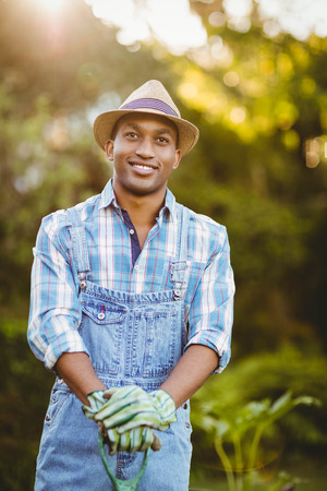 Smiling man in the garden looking awayの写真素材