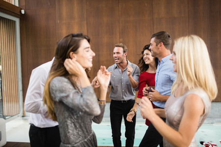Group of young friends dancing at the partyの写真素材
