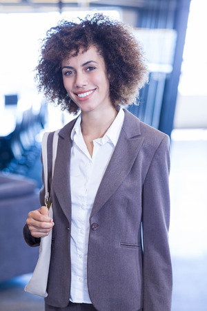 Portrait of businesswoman smiling in officeの写真素材