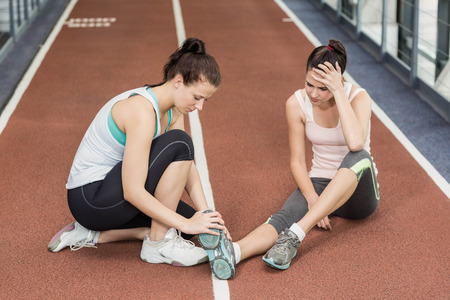 Fit woman having an ankle pain in crossfitの写真素材