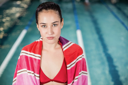 Pretty woman in swimsuit at the poolの写真素材