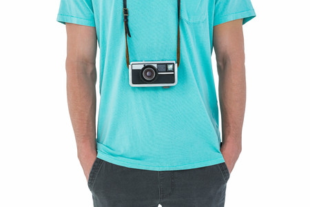 Hipster man with retro camera on white background