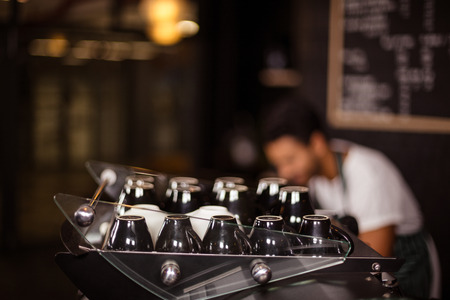 Cups on coffee machine in the barの写真素材