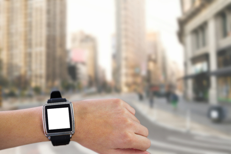 Smartwatch on wrist against new york streetの写真素材