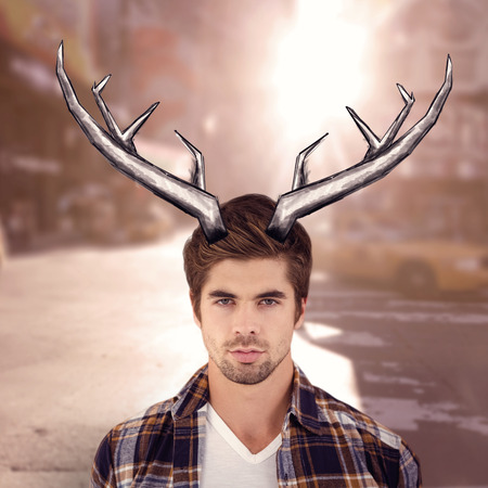 Portrait of confident man against wooden wall against blurry new york streetの写真素材