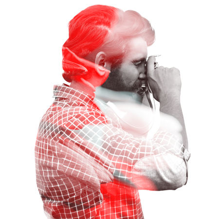 Side view of hipster photographing with camera against tulips with noteの写真素材