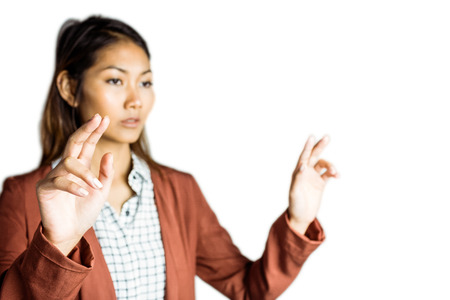 Businesswoman touching with her hands on white backgroundの写真素材