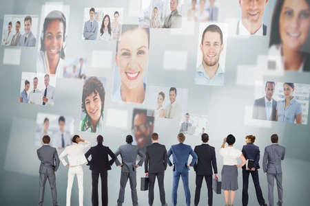 Portrait of business people against wallの写真素材