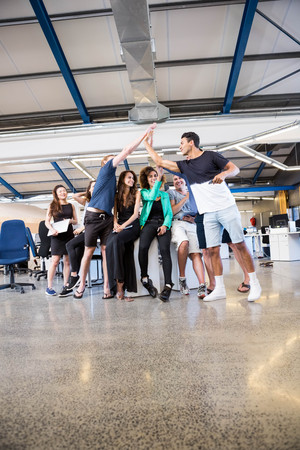 Group of businesspeople interacting during break time in office