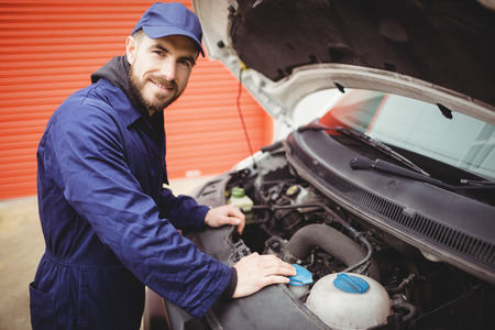 Mechanic fixing the engine of a vanの写真素材