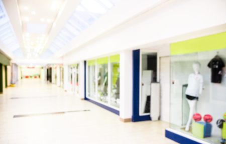 View of passage and shops in the interior of modern shopping mallの写真素材