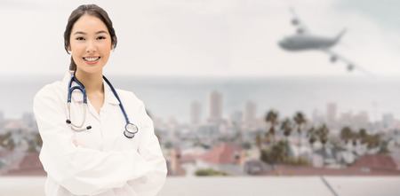 Graphic airplane against large city on the horizonの写真素材