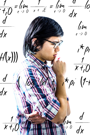 Thoughtful creative businessman looking at sticky notes  against maths equationの写真素材