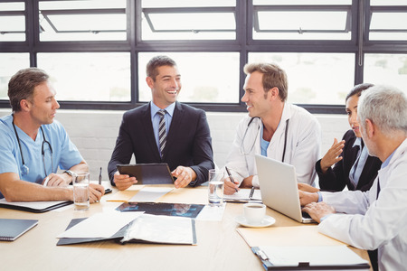Medical team interacting at a meeting in conference roomの写真素材