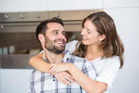 Close-up of smiling young couple at homeの写真素材