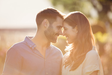 Close-up of couple romancing at parkの写真素材