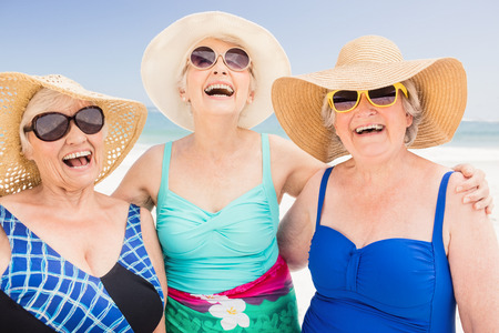 Portrait of senior woman friends on the beachの写真素材