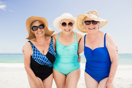 Portrait of senior woman friends on the beachの写真素材