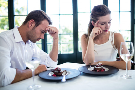 Couple into an argument on a date in a restaurantの写真素材