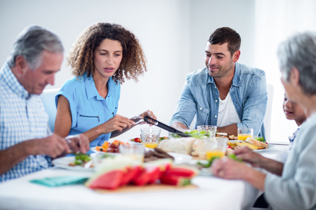 Family having breakfast together at homeの写真素材