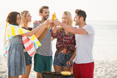 Friends having a barbecue on a sunny dayの写真素材