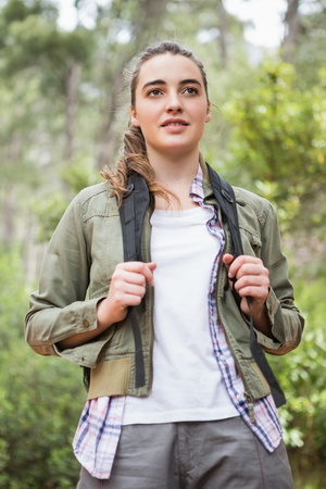 Portrait of woman with backpack in the countrysideの写真素材