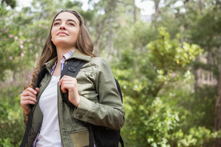 Portrait of woman with backpack in the countryside