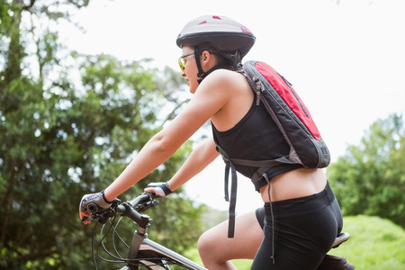 Woman riding her bike in the countrysideの写真素材