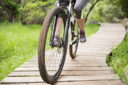 Close-up of woman cycling in the countryside