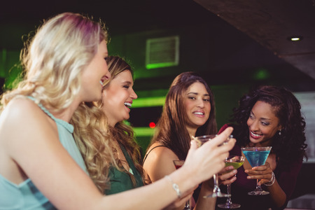 Portrait of friends having a drink in a bar
