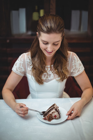 High angle view of happy woman looking at desert in restaurantの写真素材