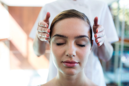 Woman receiving massage from masseur at spaの写真素材