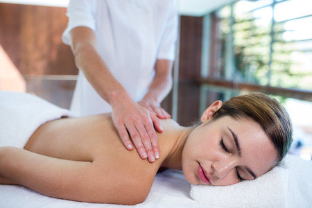 Woman receiving a back massage at spaの写真素材