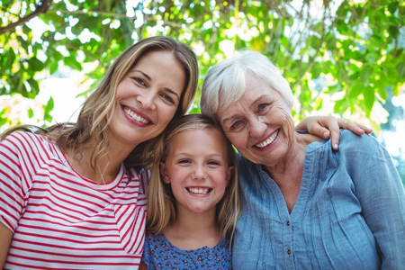 Portrait of happy family with granny standing outdoorsの写真素材