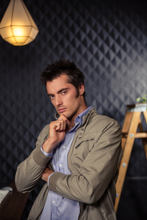 Creative businessman crossing his arms in officeの写真素材