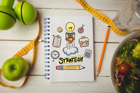 Composite image of diet stategy on wooden tableの写真素材