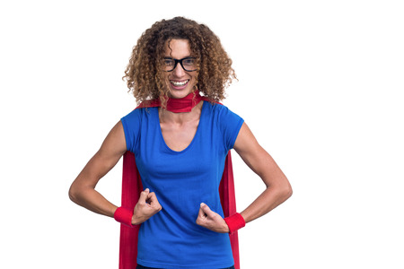 Portrait of a woman pretending to be superhero on white backgroundの写真素材