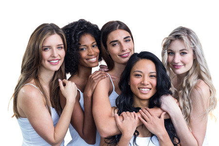Multiethnic women embracing each other on white backgroundの写真素材