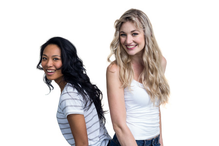 Portrait of multiethnic women smiling on white backgroundの写真素材