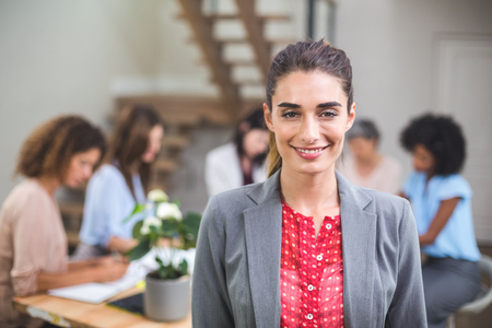 Portrait businesswoman smiling in officeの写真素材