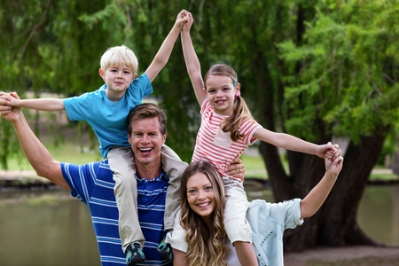 Happy family enjoying in the park on a sunny day