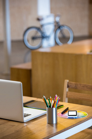 Office stationary and multi device at desk in officeの写真素材