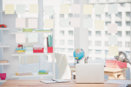 View of office interior with sticky note on window in officeの写真素材